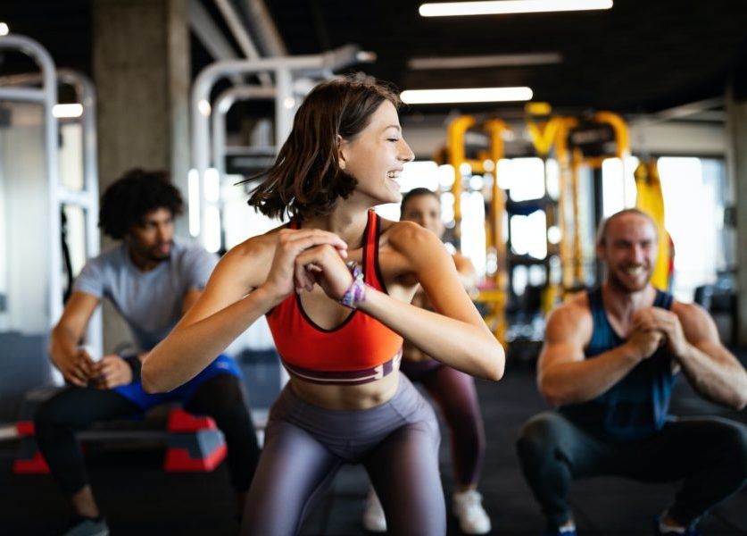 beautiful-fit-people-working-out-in-gym-together.jpg